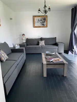 Coin salon dans l'établissement Appartement Le Domaine De Louis