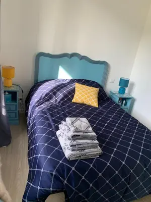 Un ou plusieurs lits dans un hébergement de l'établissement Appartement Le Domaine De Louis