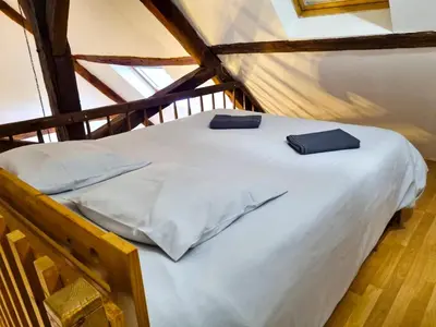 Un ou plusieurs lits dans un hébergement de l'établissement Pacy sur Eure loft en plein centre