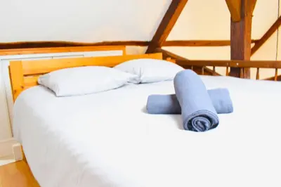 Un ou plusieurs lits dans un hébergement de l'établissement Pacy sur Eure loft en plein centre
