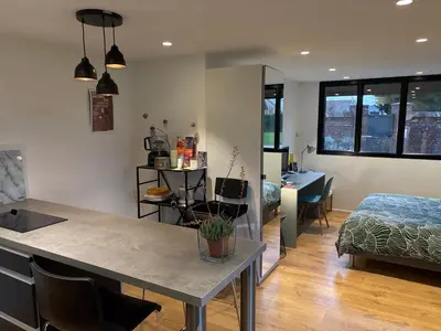 Un ou plusieurs lits dans un hébergement de l'établissement Appartement contemporain