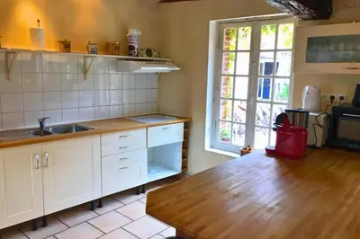 Cuisine ou kitchenette dans l'établissement Les Gîtes de Pronleroy Longère de Charme Évasion Nature et Jacuzzi