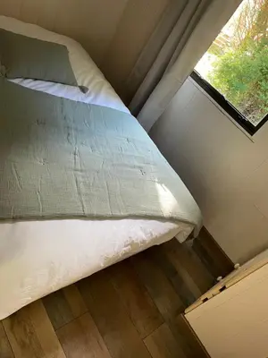 Un ou plusieurs lits dans un hébergement de l'établissement Le Gîte des Oiseaux Un Mobil-Home au Cœur des Champs