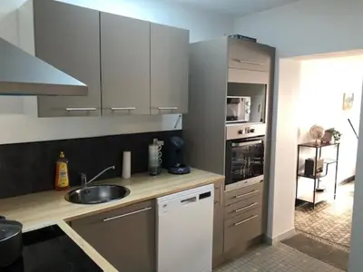 Cuisine ou kitchenette dans l'établissement La Canteraine