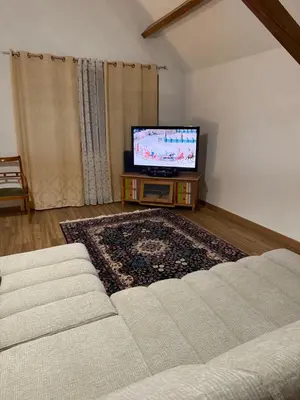 Télévision ou salle de divertissement dans l'établissement Chambre dans une Ecurie