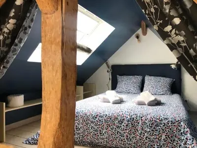 Un ou plusieurs lits dans un hébergement de l'établissement La Chapelle de Monet - Logis Les Marguerites