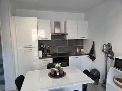 Cuisine ou kitchenette dans l'établissement La petite maison