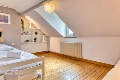 Un ou plusieurs lits dans un hébergement de l'établissement Les agapanthes jolie maison de ville à Rouen avec extérieur terrasse