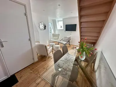 Télévision ou salle de divertissement dans l'établissement Le Duplex Appartement