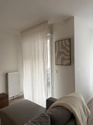 Un ou plusieurs lits dans un hébergement de l'établissement Cozy et élégant à 2 minutes de la Gare de Persan