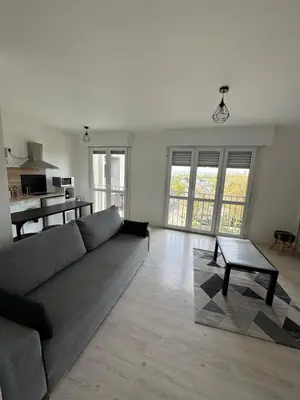 Coin salon dans l'établissement Grand studio lumineux proche gare