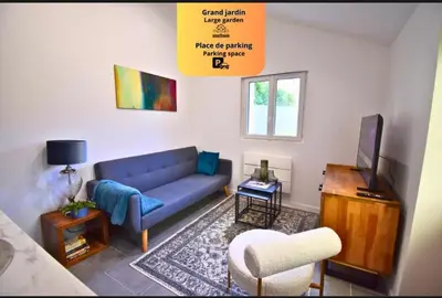 Coin salon dans l'établissement VIC Cottages