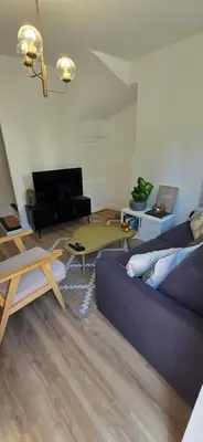 Télévision ou salle de divertissement dans l'établissement L'alcôve enchantée