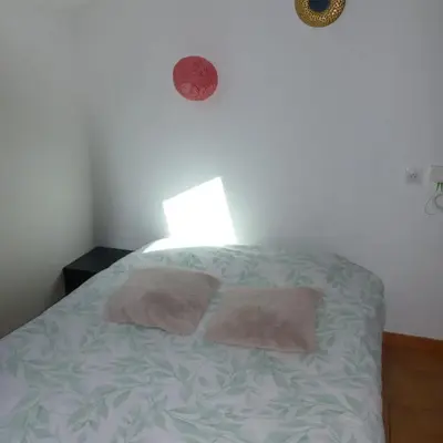 Un ou plusieurs lits dans un hébergement de l'établissement Appartement cosy à Amiens avec jardin