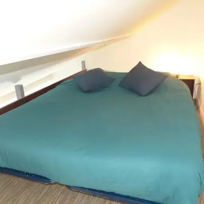 Un ou plusieurs lits dans un hébergement de l'établissement Appartement cosy à Amiens avec jardin