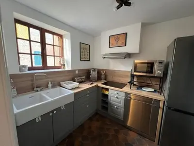Cuisine ou kitchenette dans l'établissement La Parenthèse en bord de seine