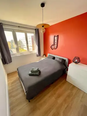 Un ou plusieurs lits dans un hébergement de l'établissement Appartement 3 Chambres & Dernier étage