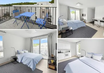 Un ou plusieurs lits dans un hébergement de l'établissement Studio lumineux avec balcon privé