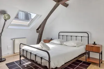 Un ou plusieurs lits dans un hébergement de l'établissement Geoffroy sublime duplex à proximité de la place du vieux marché