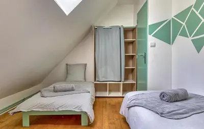Un ou plusieurs lits dans un hébergement de l'établissement Maison Vue Campagne