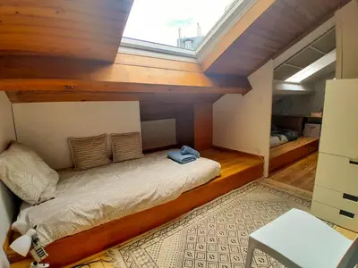 Un ou plusieurs lits dans un hébergement de l'établissement Duplex de Charme avec Bureau - Face Gare RER A