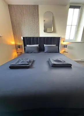 Un ou plusieurs lits dans un hébergement de l'établissement Appart Duplex Proche Centre