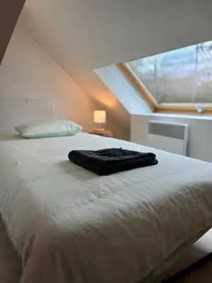 Un ou plusieurs lits dans un hébergement de l'établissement Appart Duplex Proche Centre