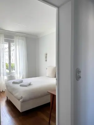 Un ou plusieurs lits dans un hébergement de l'établissement Superbe Appartement Central