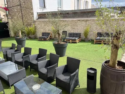 Coin salon dans l'établissement Le Faubourg Saint Martin Loft and Spa 1
