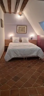 Un ou plusieurs lits dans un hébergement de l'établissement Domaine de la Ferme de Tumbrel