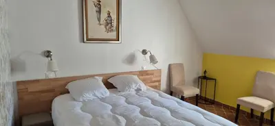 Un ou plusieurs lits dans un hébergement de l'établissement Domaine de la Ferme de Tumbrel