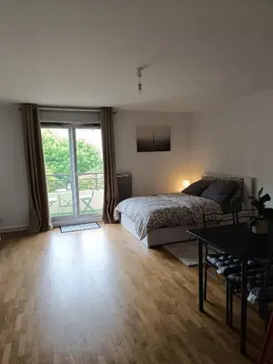 Un ou plusieurs lits dans un hébergement de l'établissement Appartement Cosy, 30 minutes de Paris