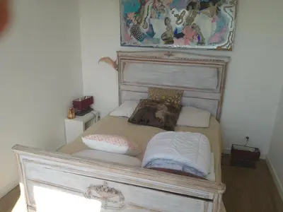 Un ou plusieurs lits dans un hébergement de l'établissement Maison Bord de Seine