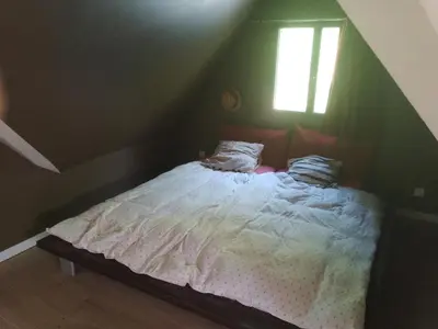 Un ou plusieurs lits dans un hébergement de l'établissement Maison Bord de Seine