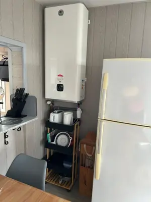 Cuisine ou kitchenette dans l'établissement La maison au calme