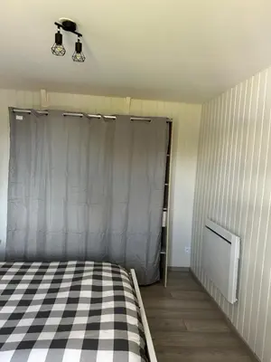 Un ou plusieurs lits dans un hébergement de l'établissement La maison au calme