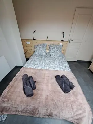 Un ou plusieurs lits dans un hébergement de l'établissement Gîte Ô Bo Bois