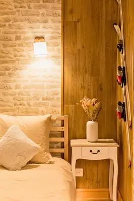 Un ou plusieurs lits dans un hébergement de l'établissement L'appart Chalet - Sauna - HyperCentre - Ambiance montagne