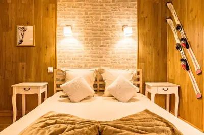 Un ou plusieurs lits dans un hébergement de l'établissement L'appart Chalet - Sauna - HyperCentre - Ambiance montagne