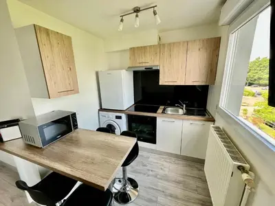 Cuisine ou kitchenette dans l'établissement La Perle