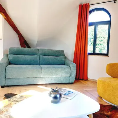 Coin salon dans l'établissement Gîte Les Jacquemarts Normands