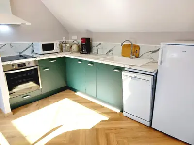 Cuisine ou kitchenette dans l'établissement Gîte Les Jacquemarts Normands