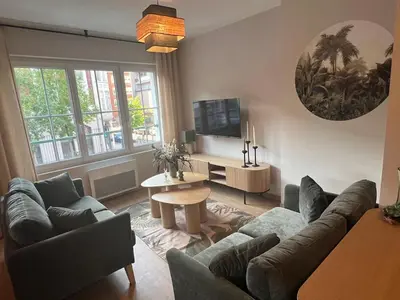 Télévision ou salle de divertissement dans l'établissement Home Design