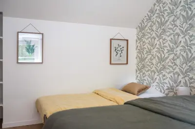 Un ou plusieurs lits dans un hébergement de l'établissement Maison Calme avec Jardin - 10 pers - Proche Centre Rouen