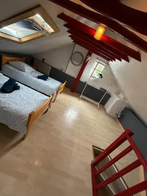 Un ou plusieurs lits dans un hébergement de l'établissement Maison de ville cosy pour 4 personnes
