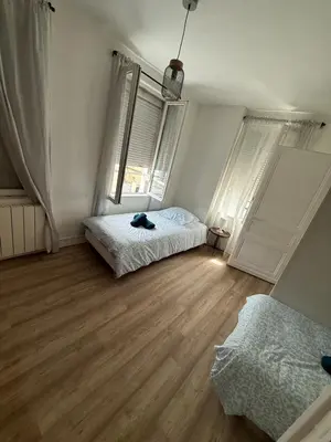 Un ou plusieurs lits dans un hébergement de l'établissement Maison de ville cosy pour 4 personnes