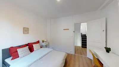 Un ou plusieurs lits dans un hébergement de l'établissement Maison cosy et calme à proximité de la gare