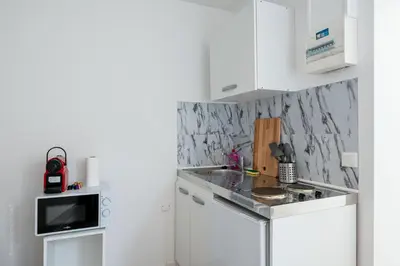 Cuisine ou kitchenette dans l'établissement Studio tout équipé proche centre ville & gare