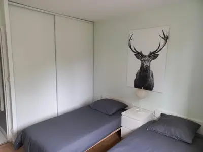 Un ou plusieurs lits dans un hébergement de l'établissement Maison chaleureuse de plain pied avec 3 chambres