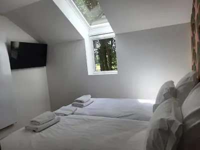 Un ou plusieurs lits dans un hébergement de l'établissement Hôtel du Golf De Jumièges